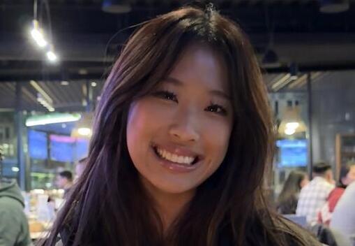 Sherry Chen sitting at table in a restaurant