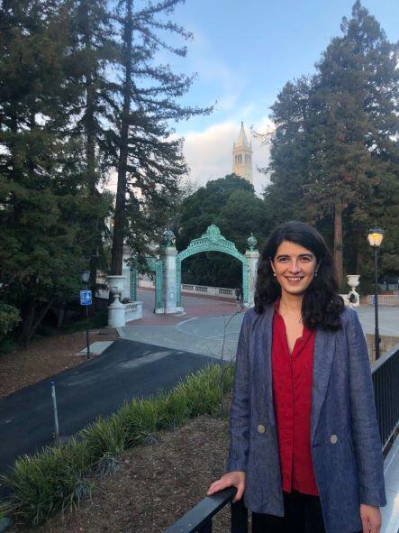 Ana Vidu standing on UC Berkeley campus with Sather Gate in background