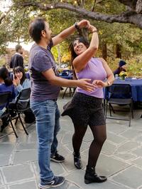 Postdocs dancing to music at PostdocFest dinner