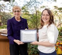 Vice Chancellor for Research Dr. Katherine Yelick presents the postdoc award to Dr. Carly Schissel