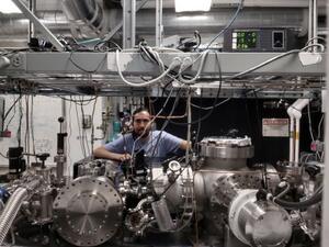 Rafael Quintero-Bermudez in lab standing among equipment